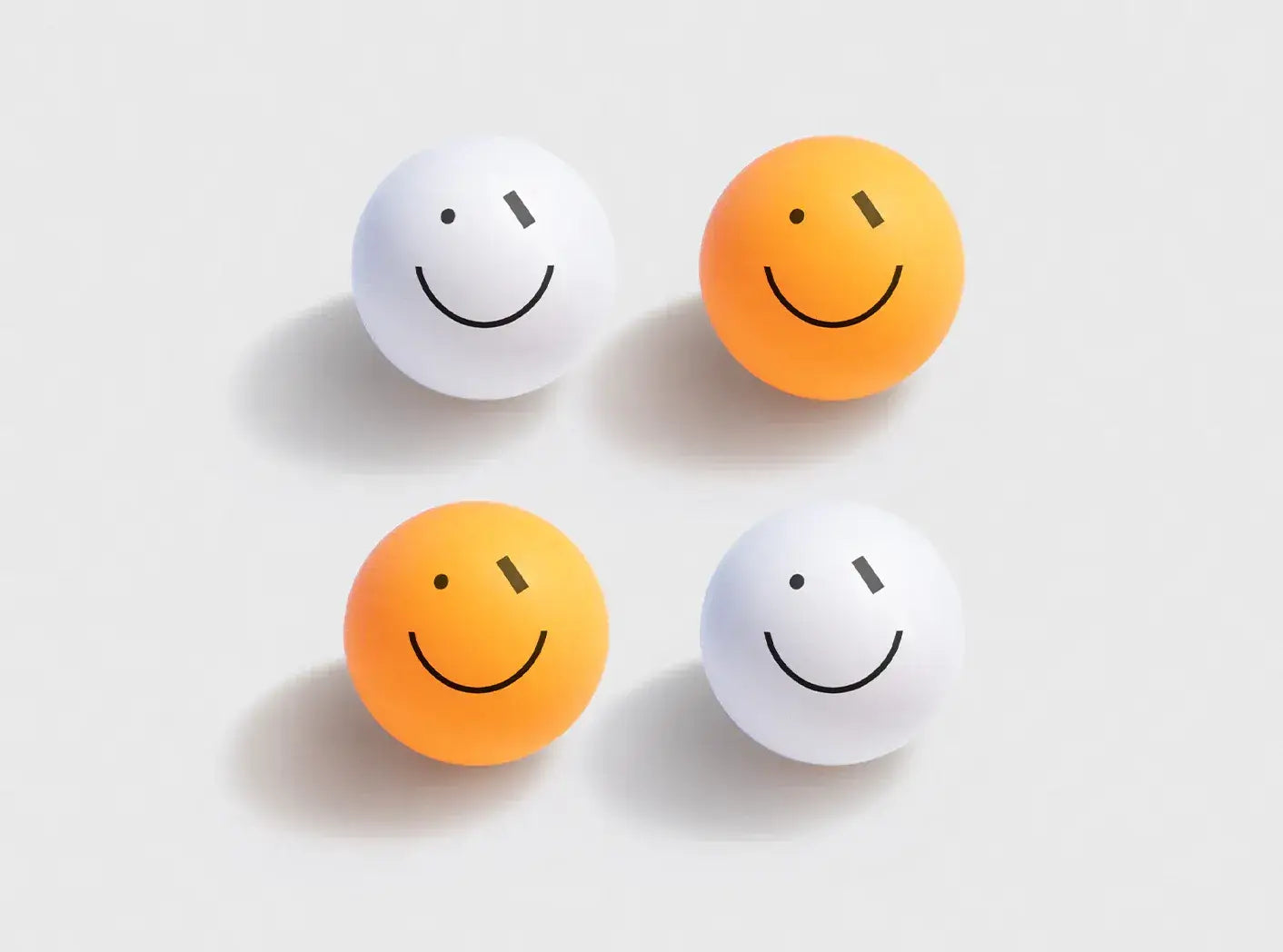 Balles de ping-pong Smiley Wink blanches et orange avec motif smiley