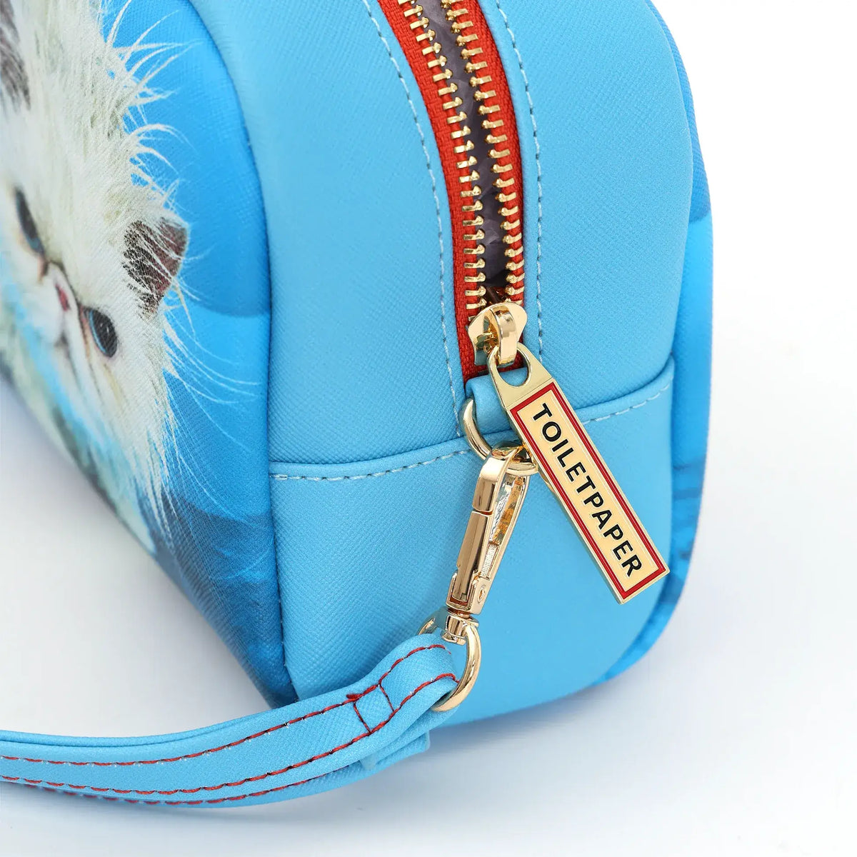 Zoom sur la fermeture éclair de la trousse de toilette Angry Cat