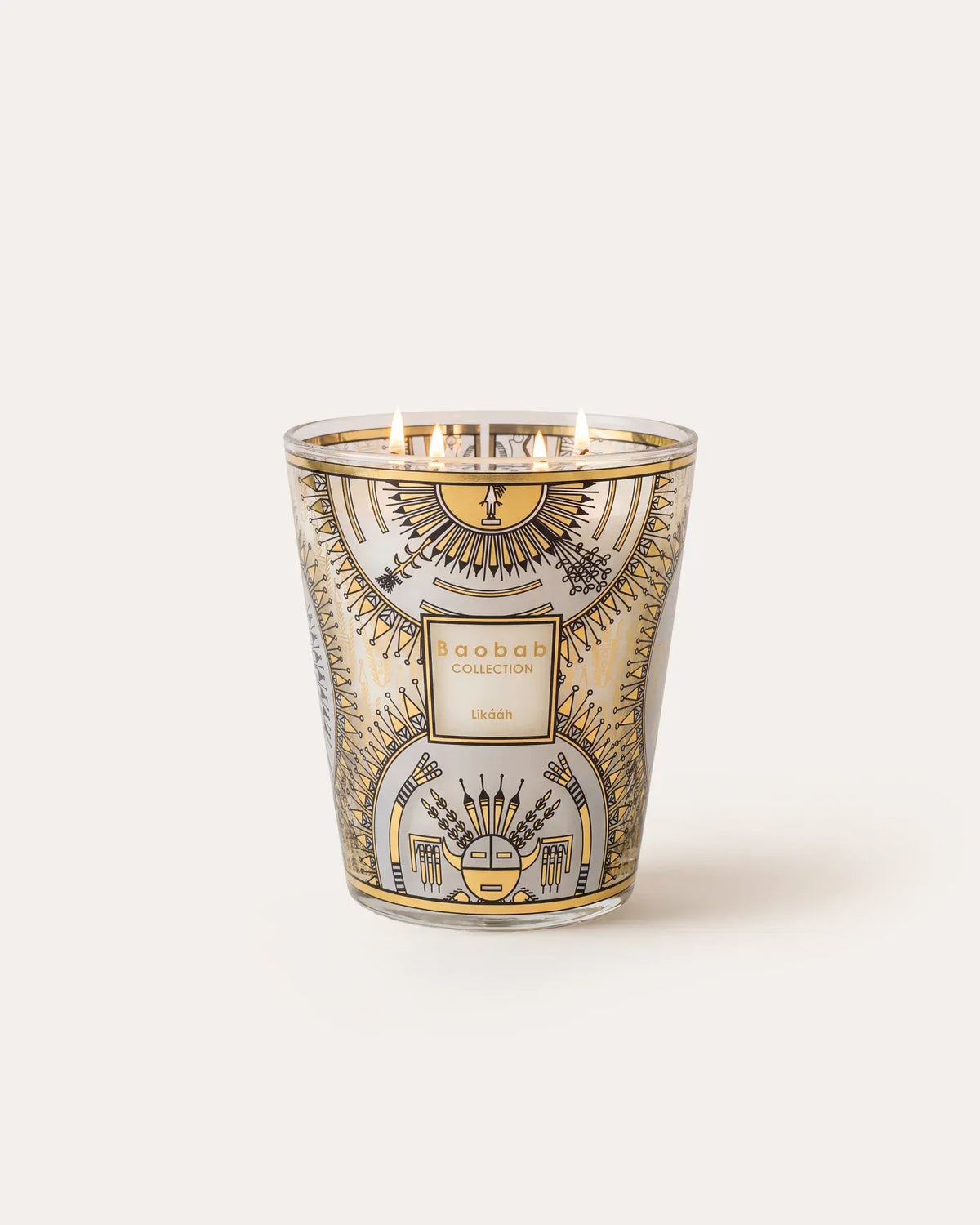 Bougie parfumée Likááh Baobab Collection allumée, décor sérigraphié noir et or sur verre