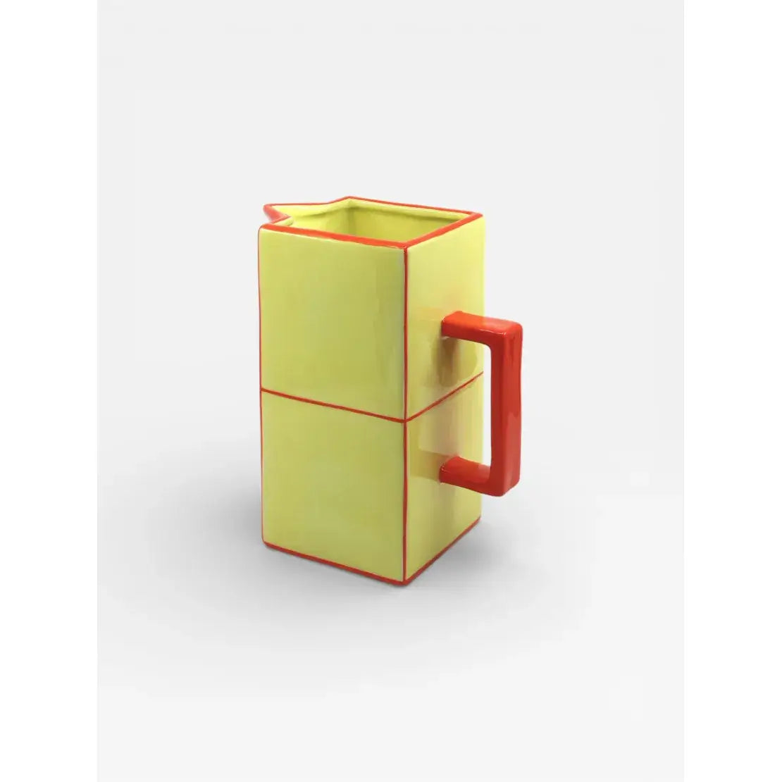Carafe en céramique jaune et orange design graphique vue de trois quarts