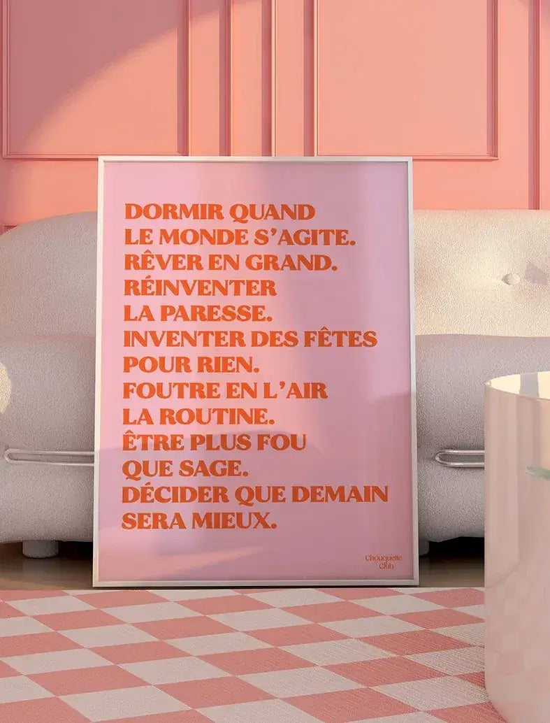 Affiche "Rêver en grand" encadrée, orange sur fond rose.