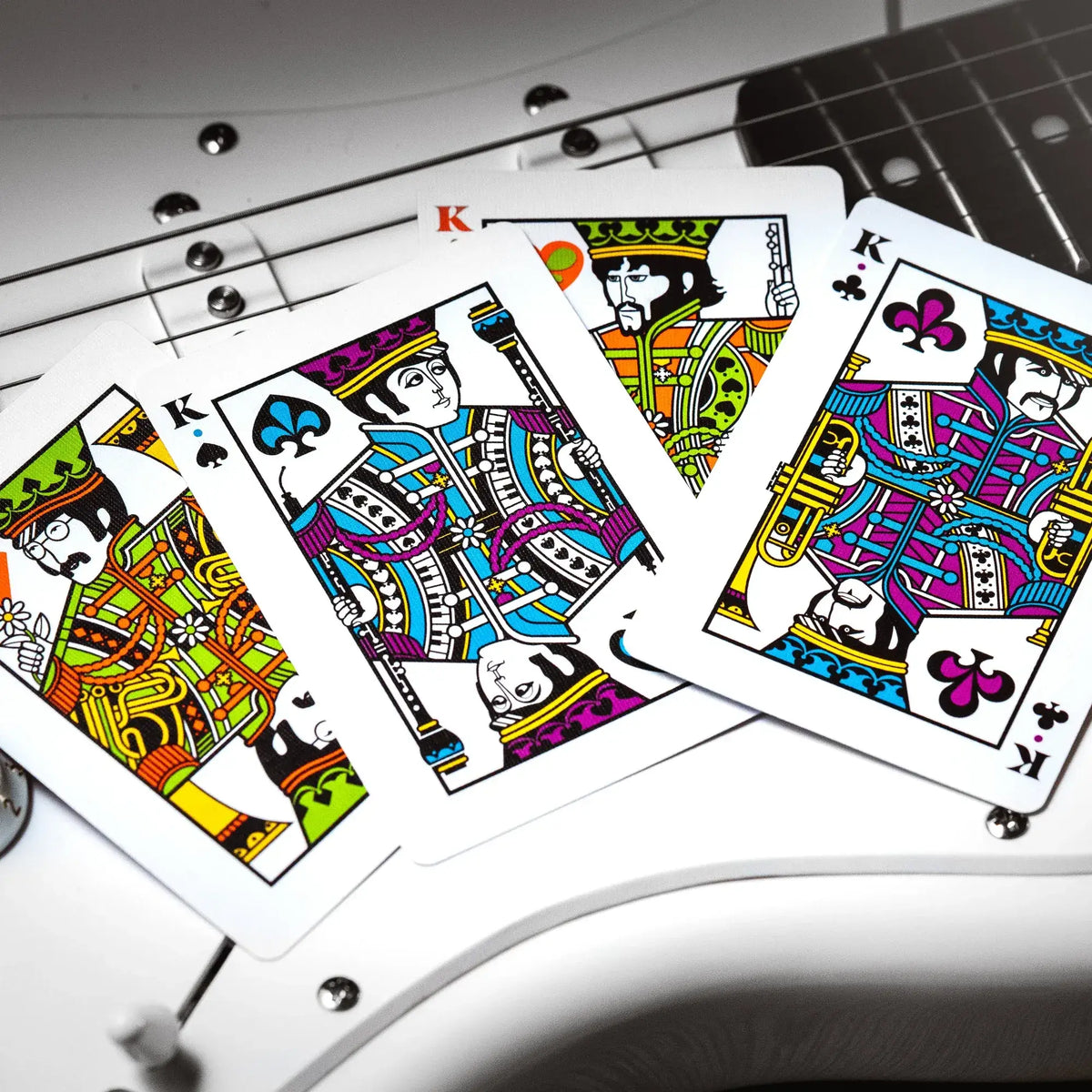 Les 4 rois du jeu de carte représentant chacun un membre du groupe