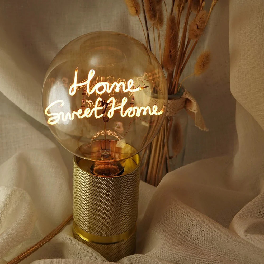 Ampoule message in the bulb : verre ambré avec message led home sweet home écrit en attaché présenté sur socle doré