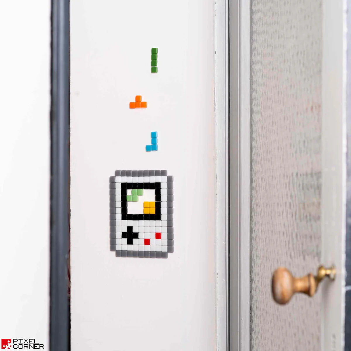 La mosaïque pixel art Boygame sur un mur