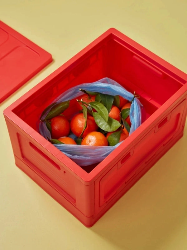 Boite rouge taille large Studio About vue du dessus avec des clémentine à l'intérieur.